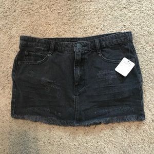 Free people black jean skirt size 2 with tags.